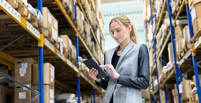 A woman holding a tablet.