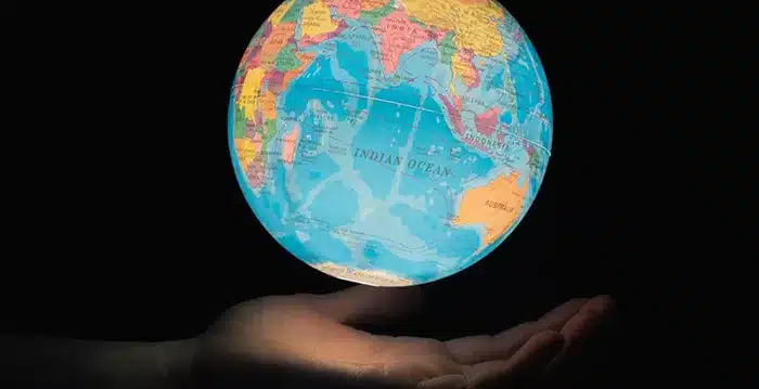 A hand holding globe.