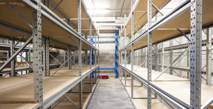 Empty shelves in a warehouse.